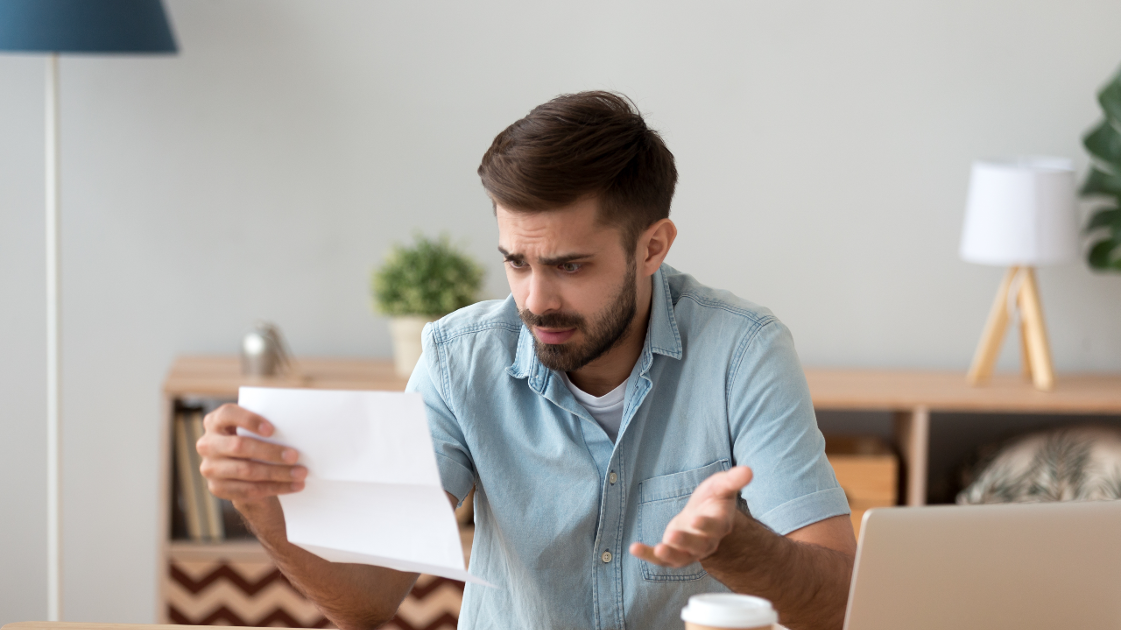 Man receiving mailed notification of data breach.