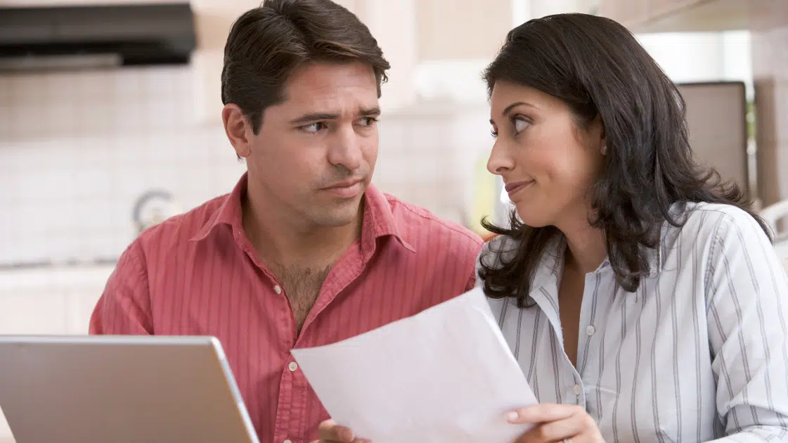 Couple working on home financials.