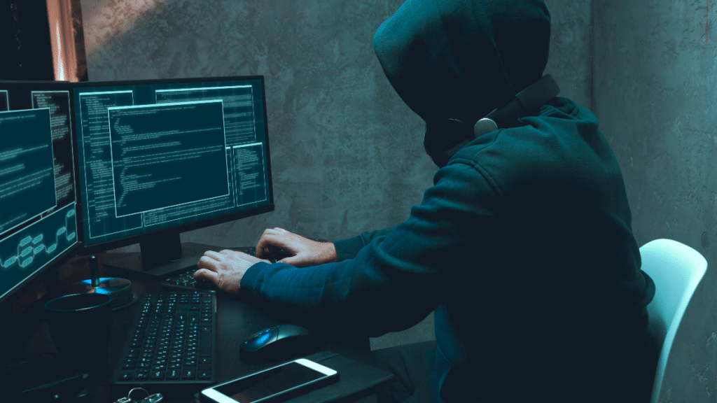 Hacker breaching unsecured systems.