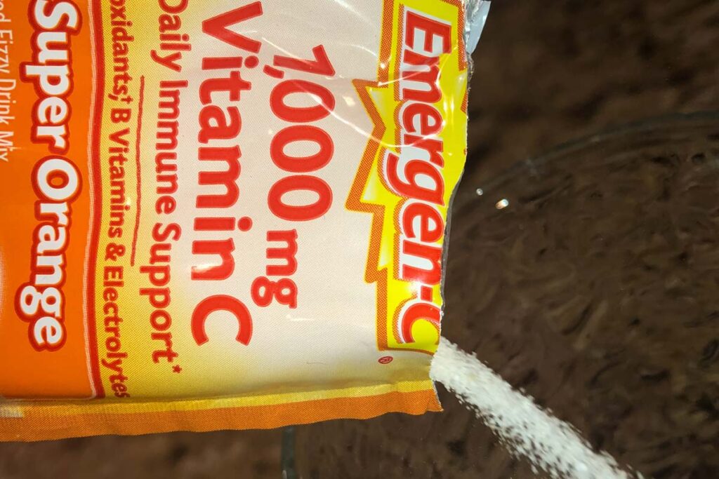 Close up of an Emergen-C packet being poured, representing the Emergen-C class action.