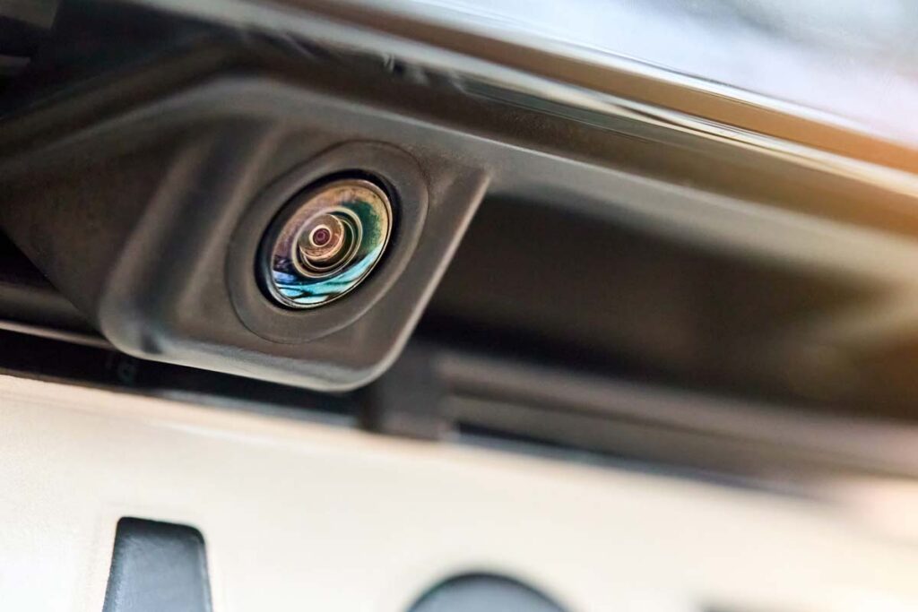 Close up of a rear view camera on the back of a vehicle, representing the Stellantis recalls.