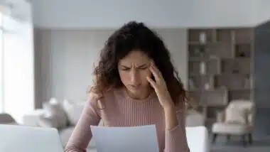 Woman finding confusing information on bad credit report.