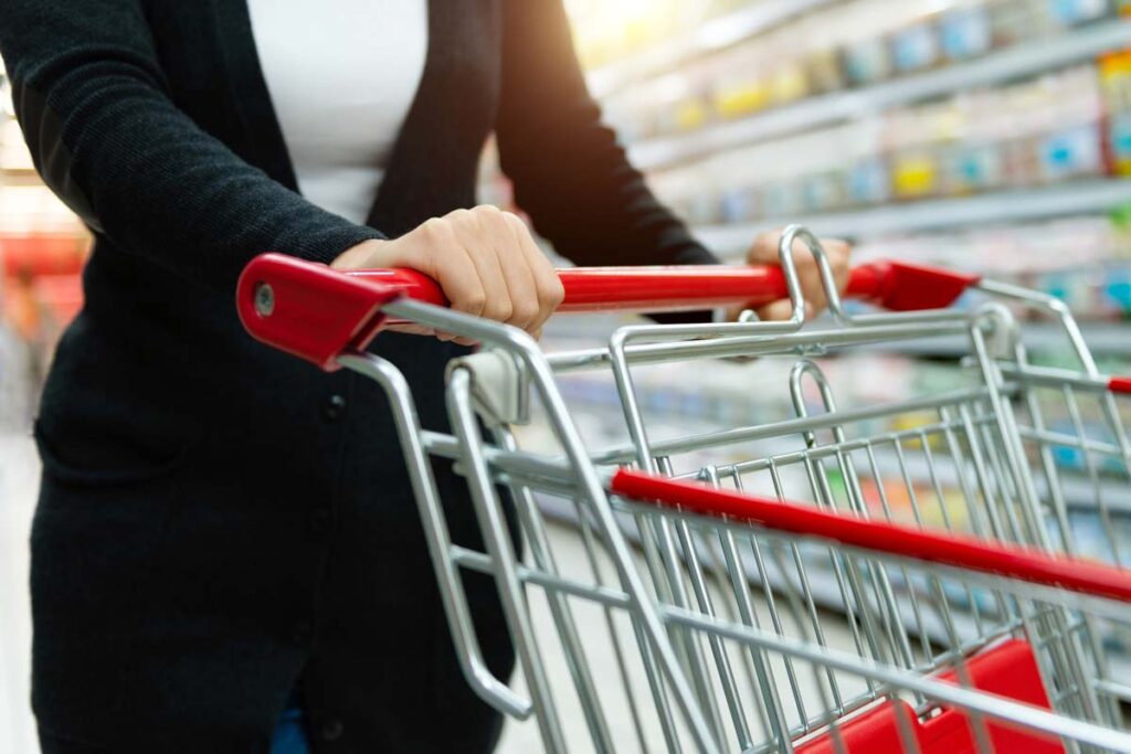 Close up of a woman pushing a shopping cart, representing top recalls for the week of May 27.