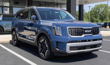 A blue Kia Telluride on display at a dealership, representing the Kia park outside recall.
