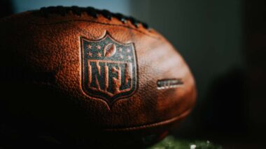 Close up of NFL logo on a football, representing the DirecTV Sunday Ticket.