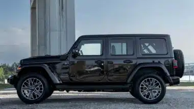 Side view of a black Jeep 4XE, representing the Jeep class action.