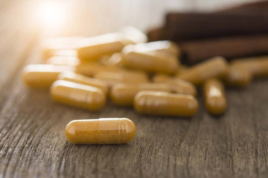 Close up of beige colored capsules on a table, representing the Zenwise class action.