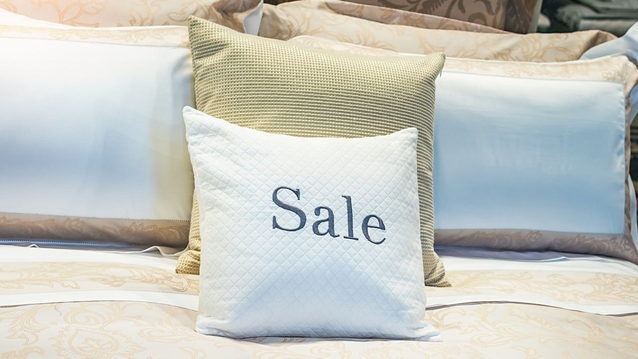 SALE - inscription on the pillow in the store of linen and furniture during the sale
