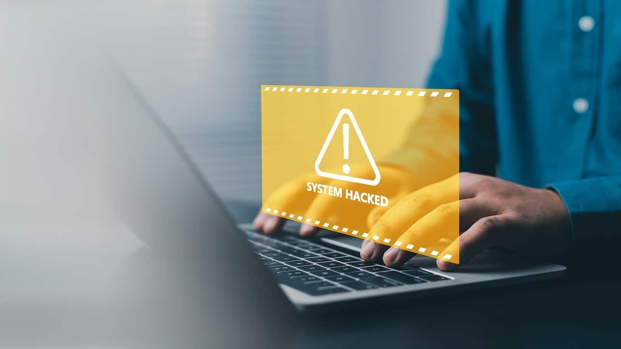 System hacked cybersecurity alert concept