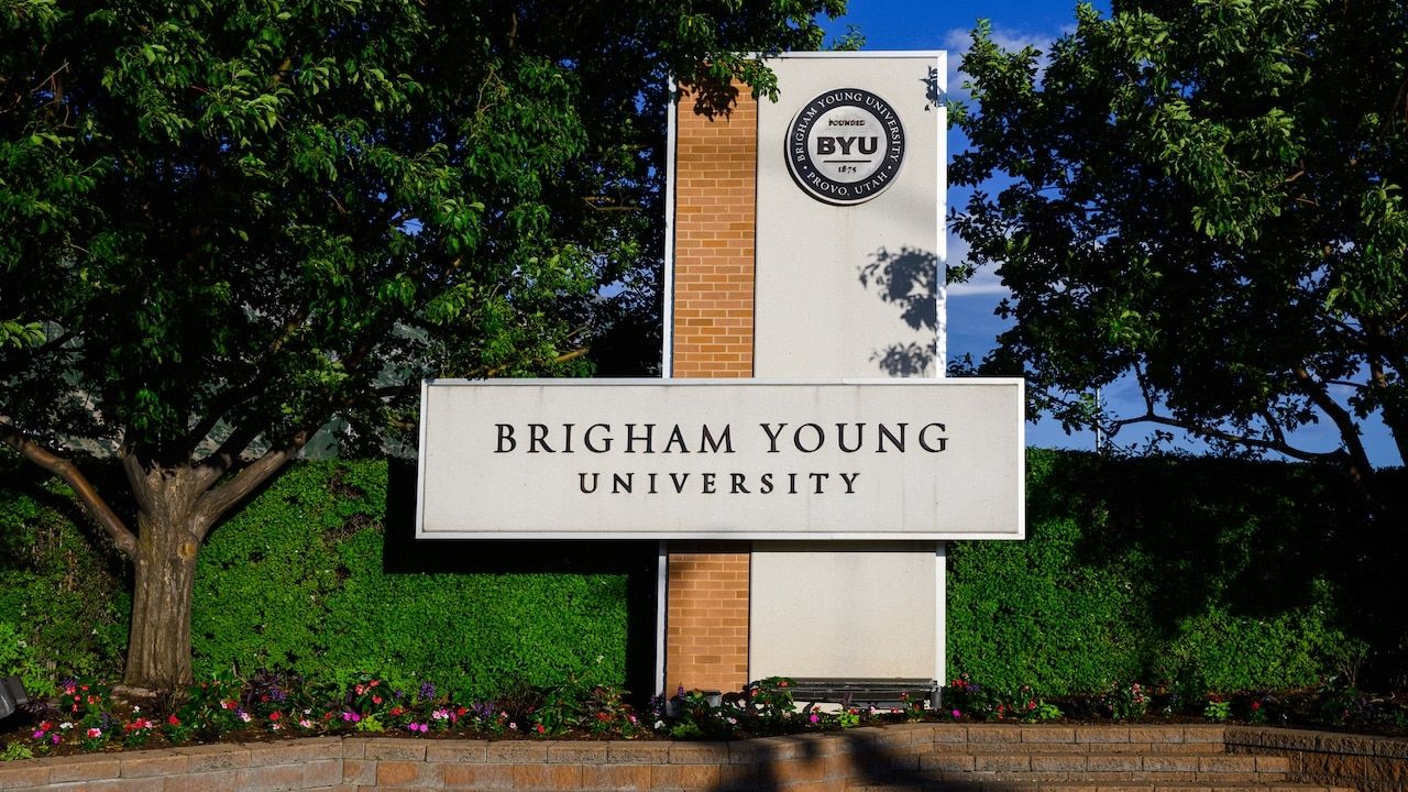 Sign with text at Brigham Young University in Provo Utah in warm evening light institution affiliated with LDS church