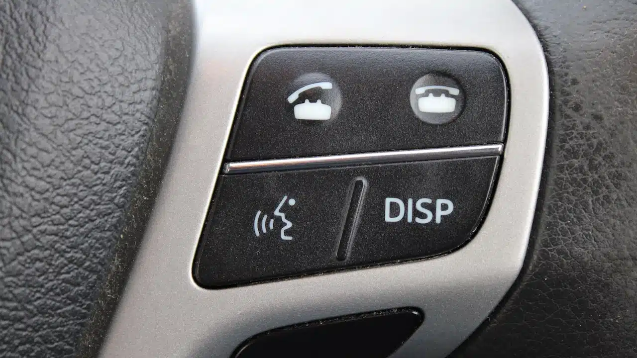 Close up of a control panel from a car steering wheel, buttons to pickup and end a call