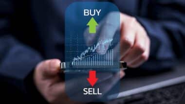 Businessman trader with growing virtual hologram stock, Buy and sell