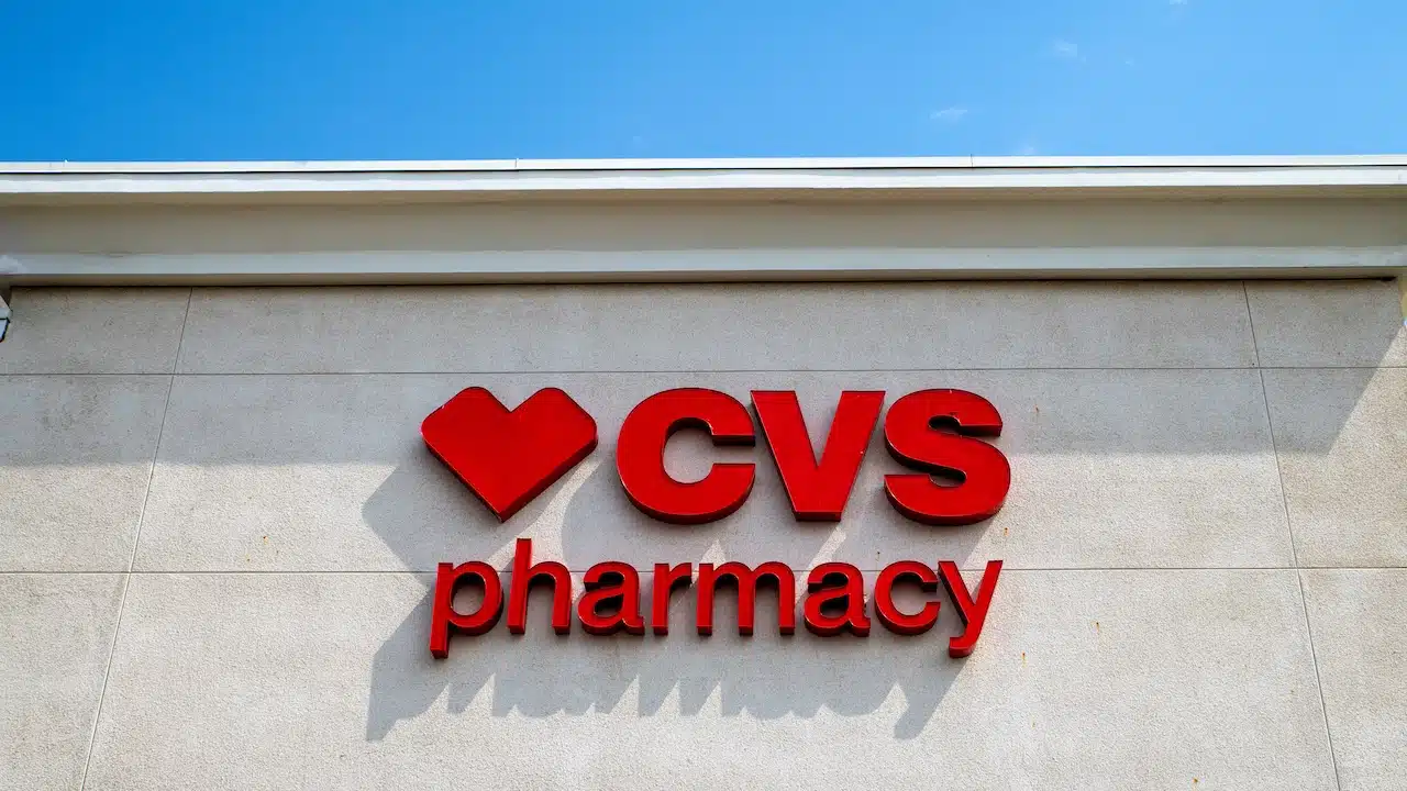 CVS Pharmacy store front, sign and red logo, blue sky.