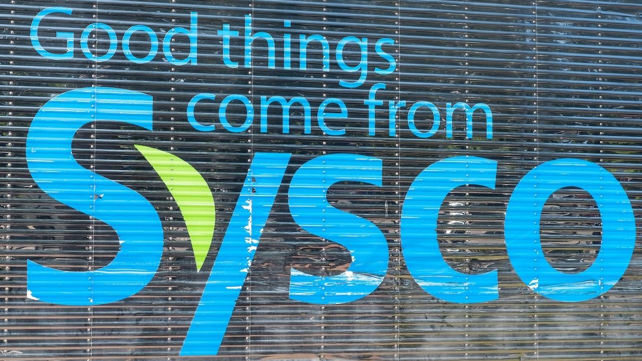 Closeup of "Good Things Come from Sysco" signage on side of Sysco delivery truck.