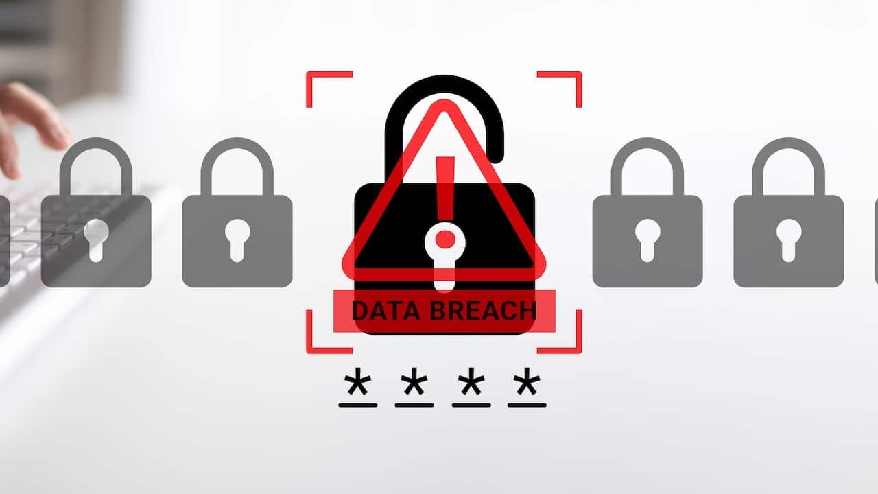 A modern cybersecurity concept highlighting a data breach warning alongside a computer keyboard