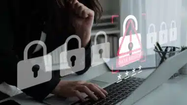 The image illustrates a woman working on a laptop with digital security icons, highlighting critical concerns about data breaches and the need for cybersecurity measures.