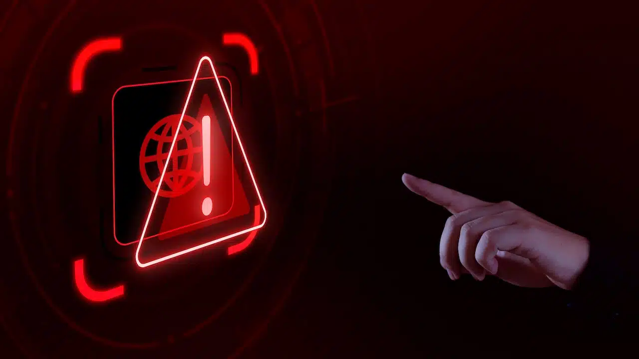 Hand touching anomaly warning icon due to hacker attack Cyber ​​Anomaly Notification,hacker attack maintenance concept and hacking cybersecurity cyber attac