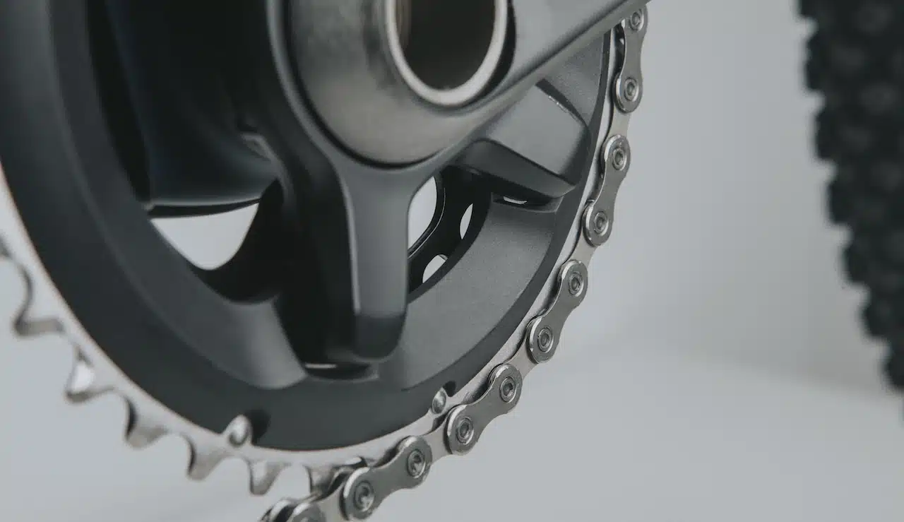 Mountain bike crankset and chain close up view.
