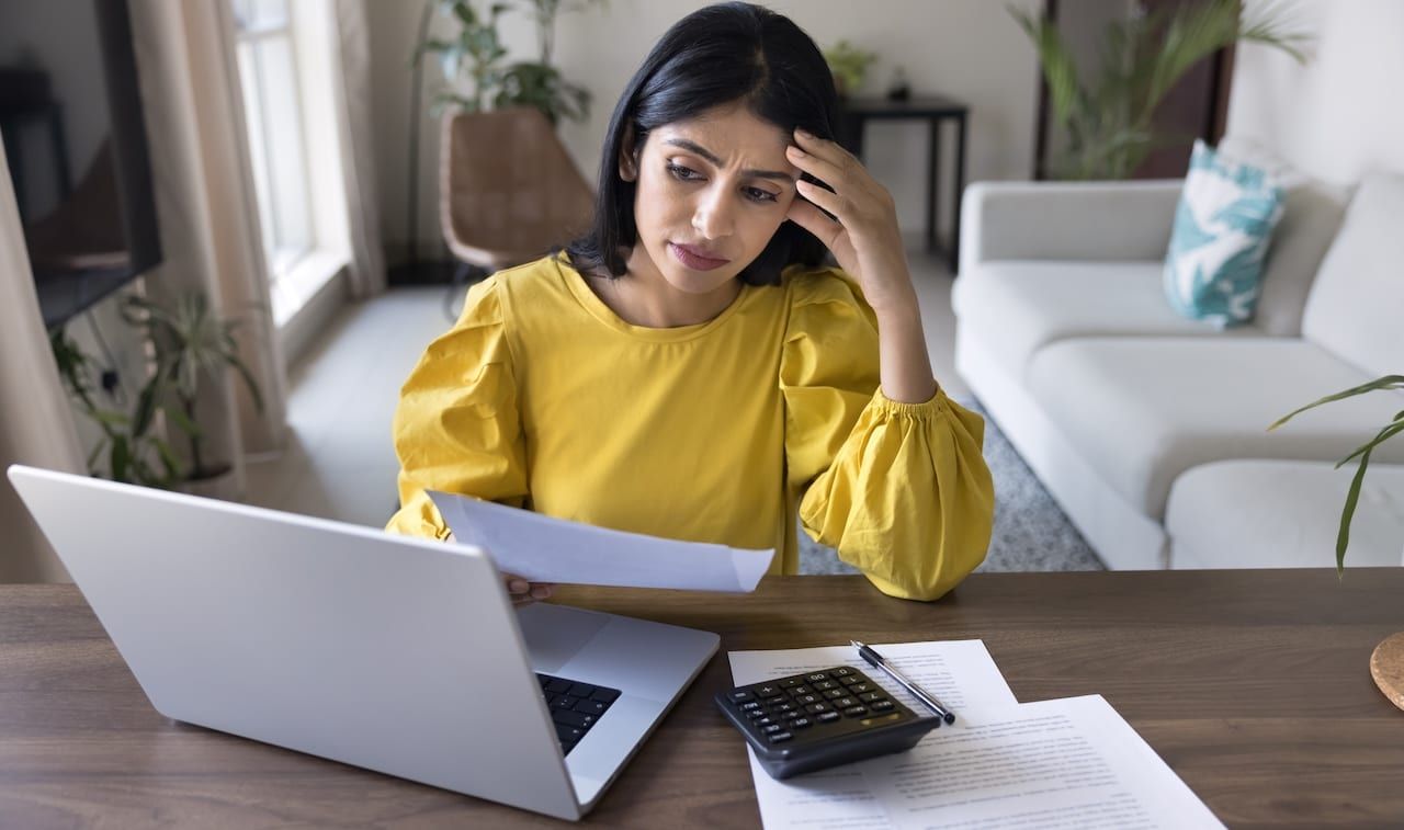 Young Indian woman feel stressed due to financial issues.