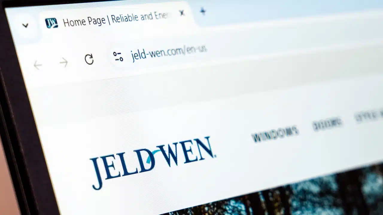 Jeld-Wen website showcasing windows, doors, and home building products displayed on a screen.