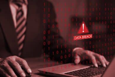Businessman using laptop system hacked warning alert warning signs.