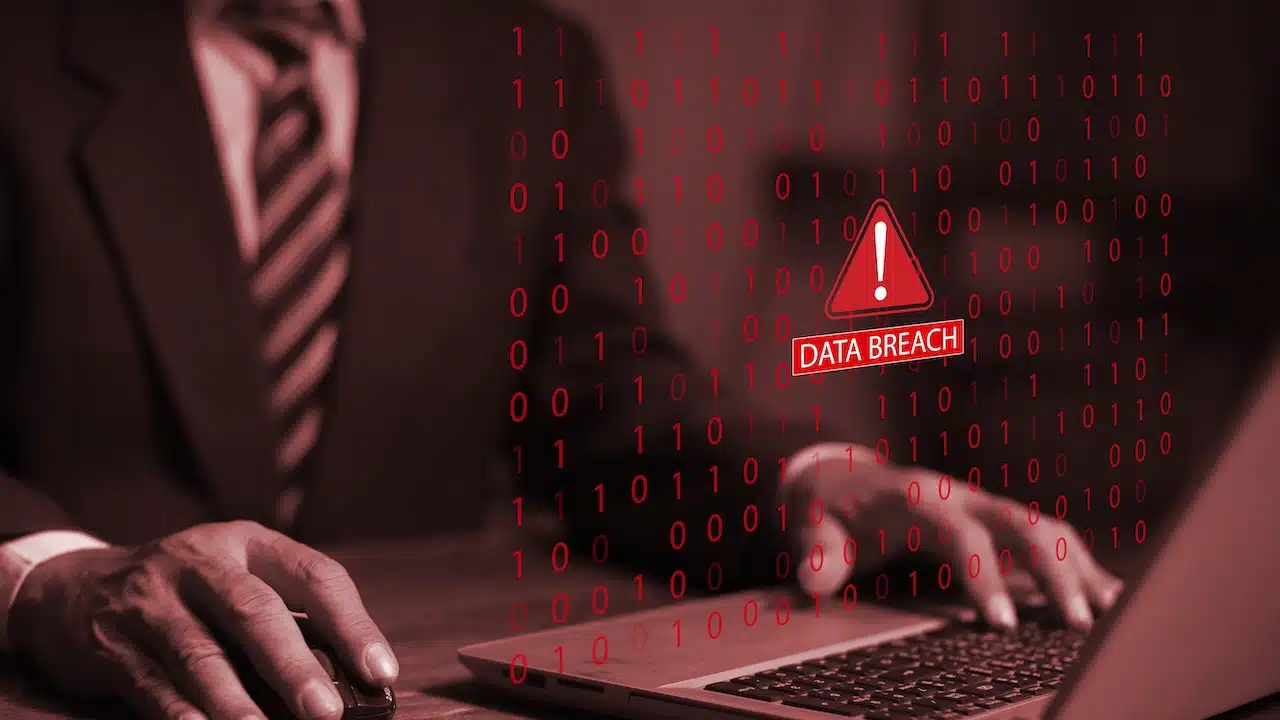 Businessman using laptop system hacked warning alert warning signs.