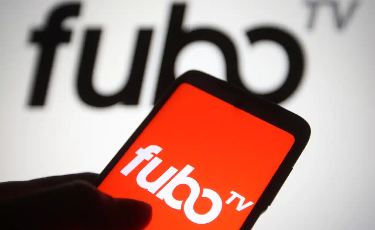 FuboTV logo is seen on a mobile phone and a computer screen.