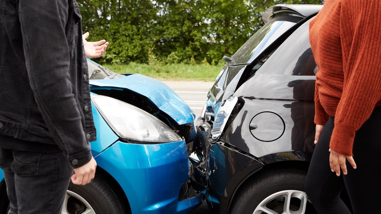 Two Angry Motorists Arguing Over Responsibility For Car Accident