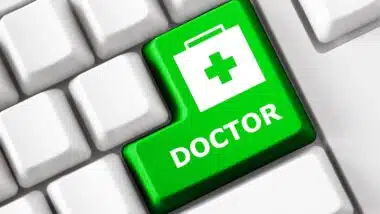Color button on the keyboard with doctor suitcase image and doctor text. Online Health care concept.