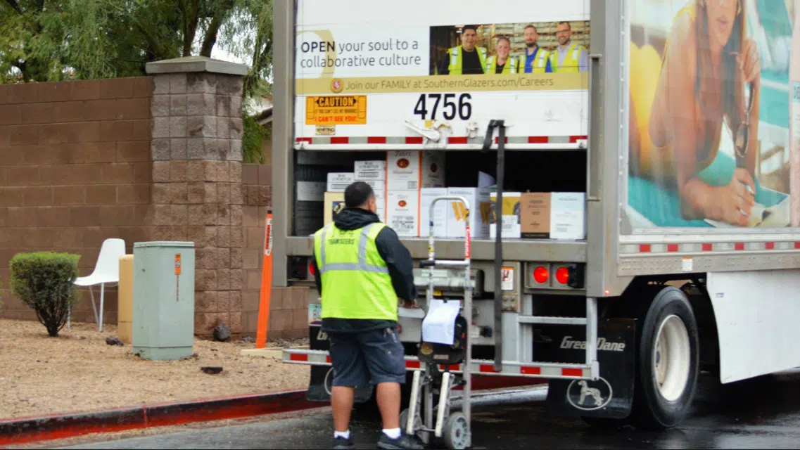 unloading alcohol from truck.