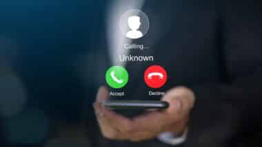 smartphone with incoming call from unknown number, spam