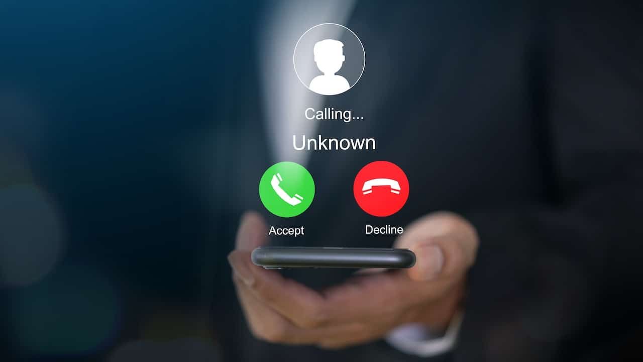 smartphone with incoming call from unknown number, spam