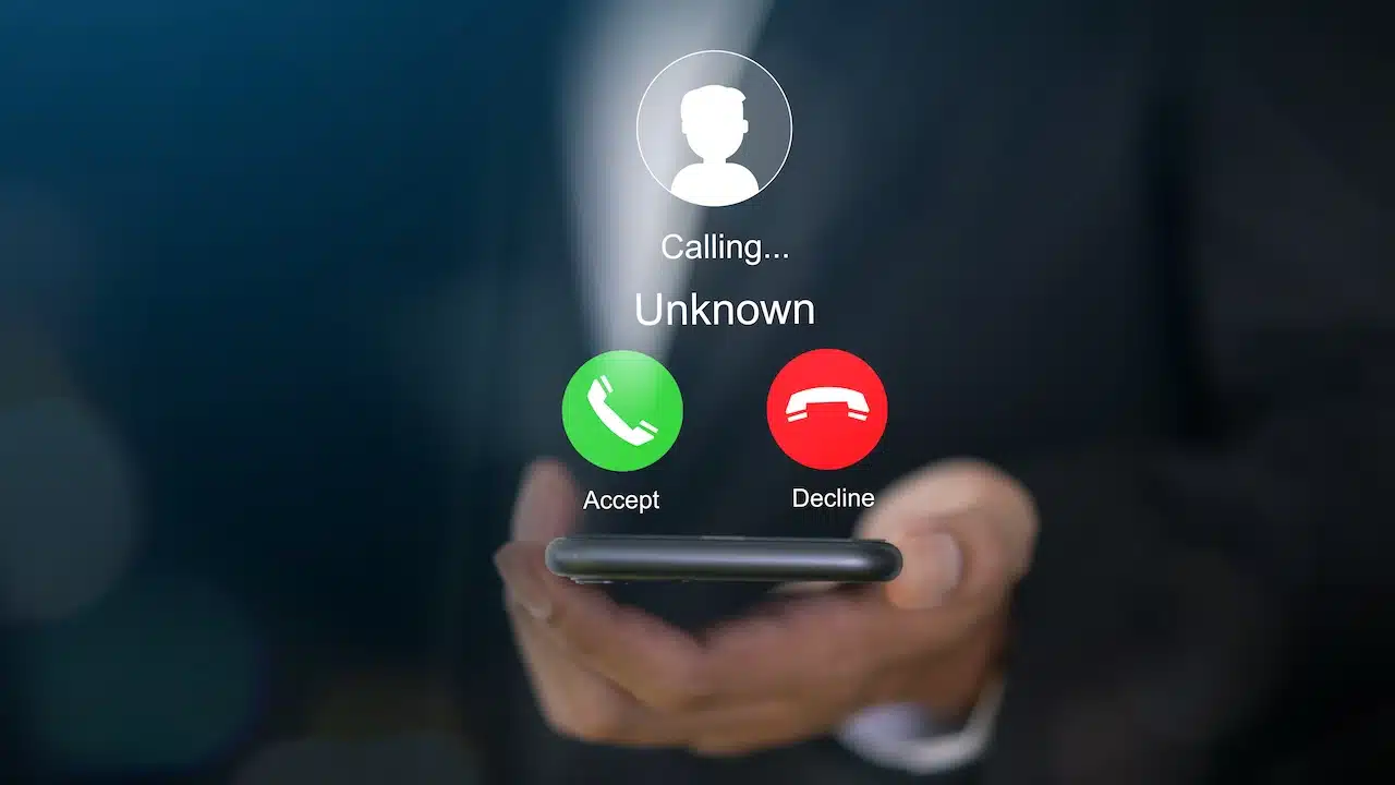smartphone with incoming call from unknown number, spam