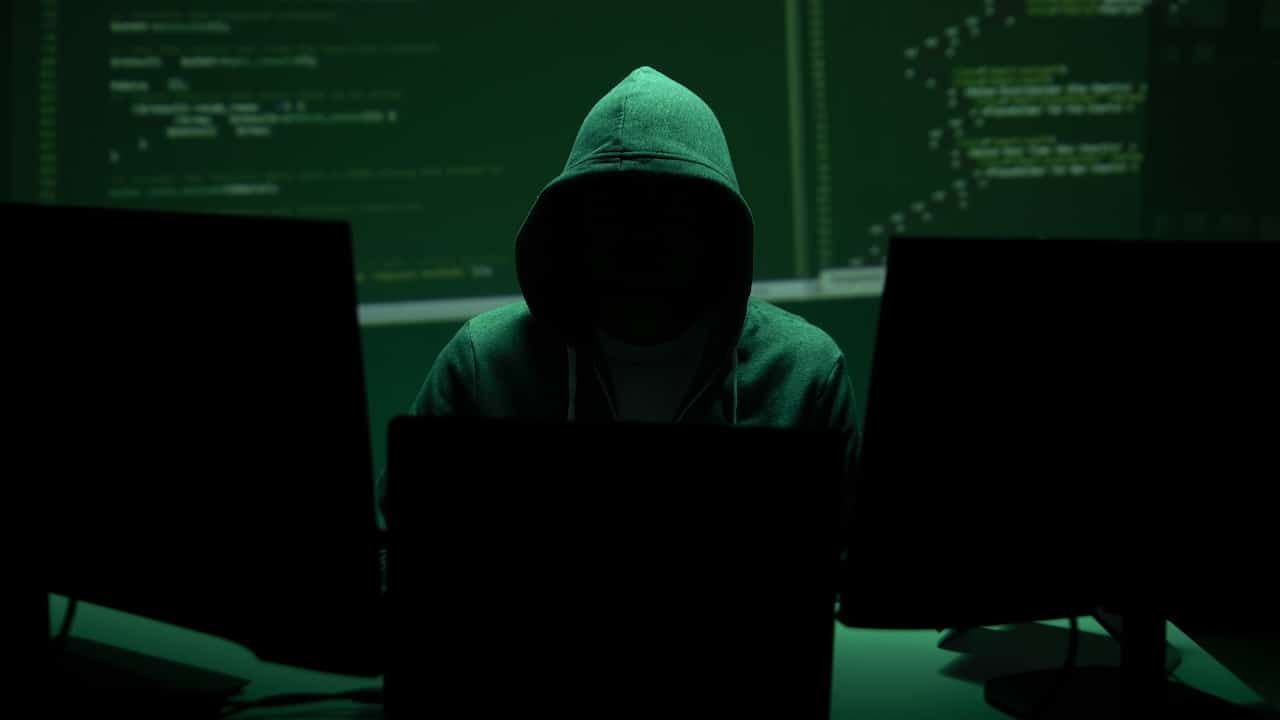 Anonymous hacker represents cyberattack risk and data breach concept.