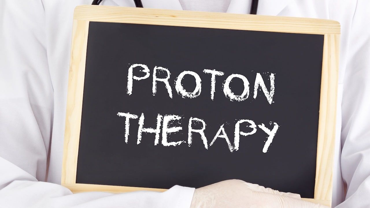 Doctor shows information: proton therapy