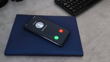 Smartphone with incoming call from unknown caller.