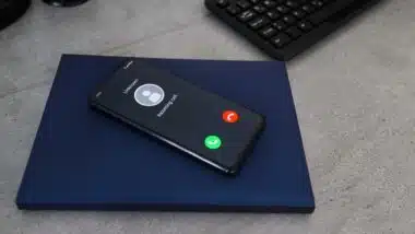 Smartphone with incoming call from unknown caller.