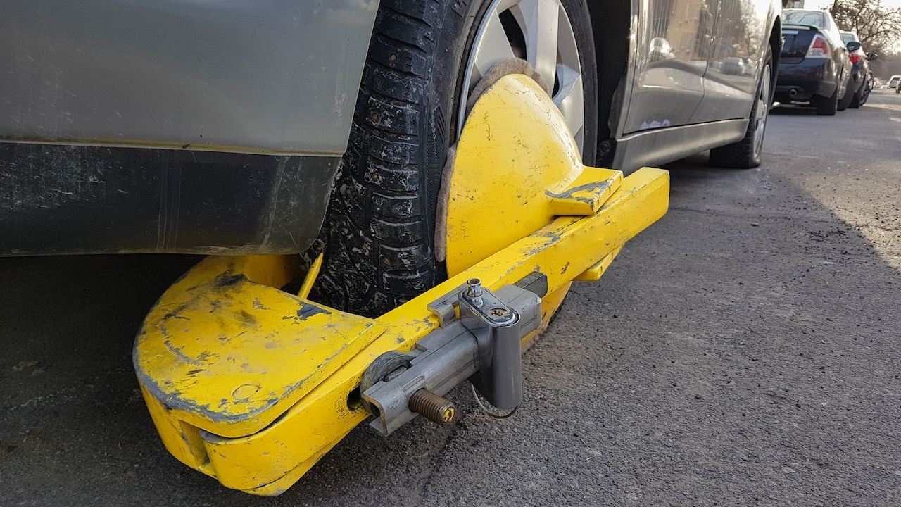 Car wheel blocked by wheel boot
