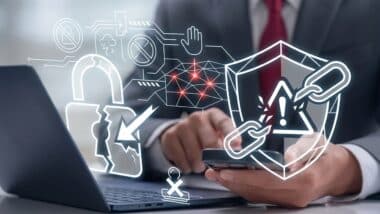 Cybersecurity Data Breach Concept with Broken Padlock and Shield on Laptop Screen