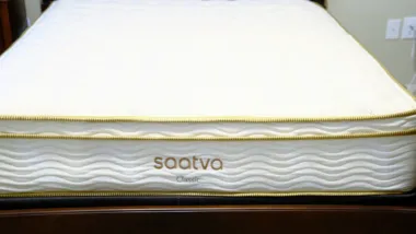 Saatva mattress on bed frame.