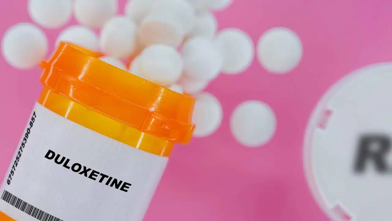 Duloxetine Rx medicine pills in plactic vial with tablets.