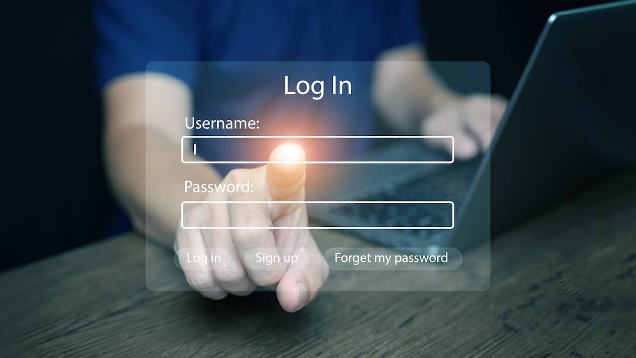 Finger pressing login button