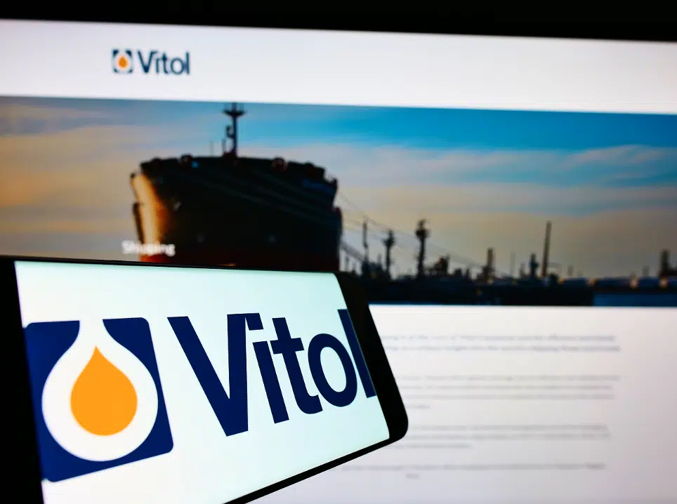 Mobile phone with logo of Dutch trading company Vitol Holding B.V. on screen in front of business website.