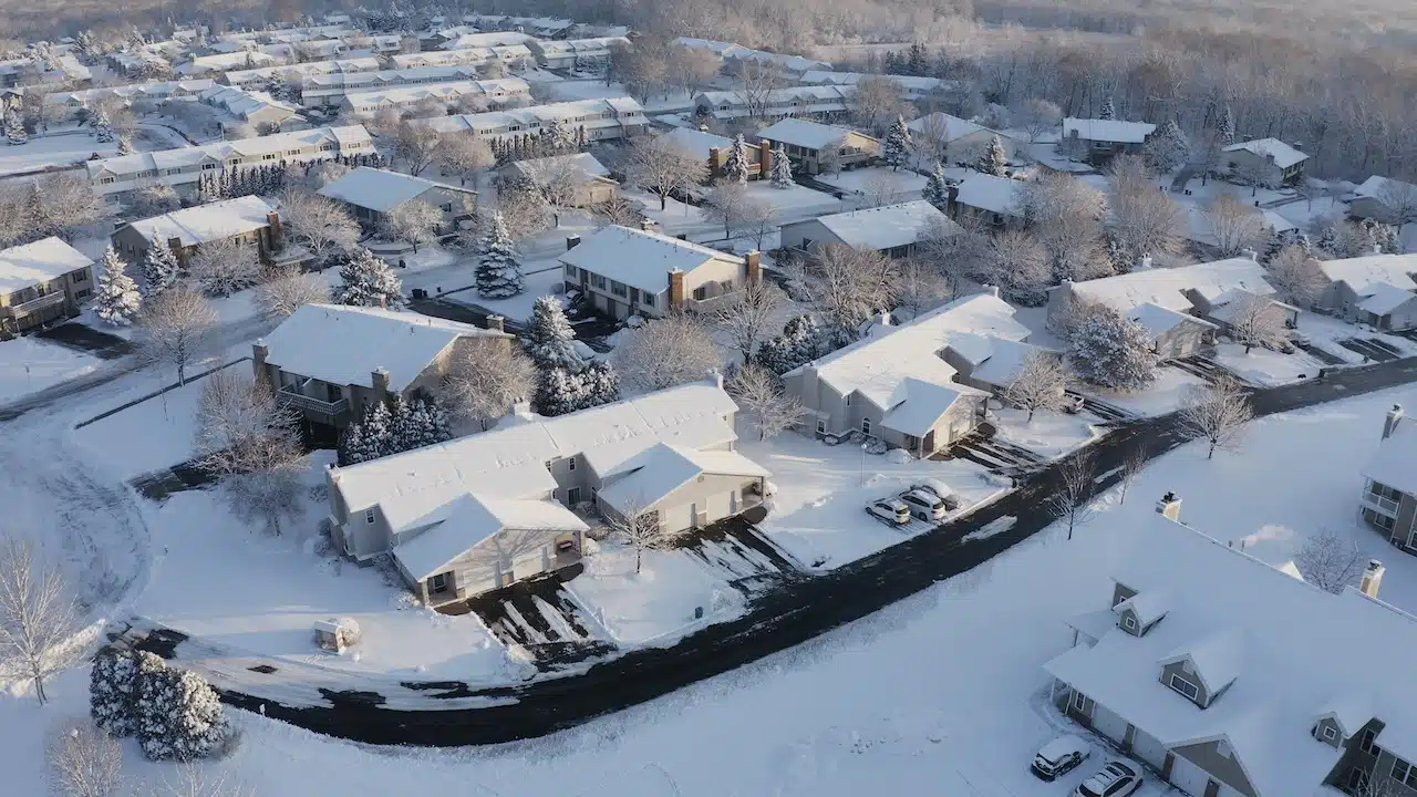Aerial view of residential houses covered snow at winter season.