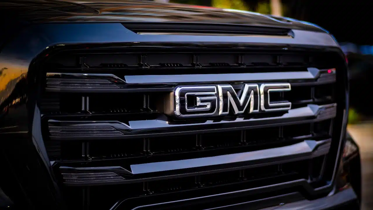 A detail photo of big front grille and logo of GMC Truck (General Motor Company).