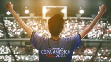 Enthusiastic Fan Celebrates Copa America USA 2024 in Packed Stadium During Exciting Match