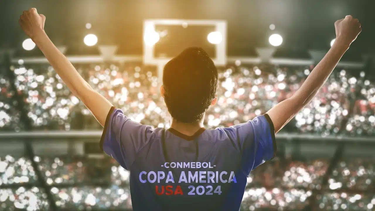 Enthusiastic Fan Celebrates Copa America USA 2024 in Packed Stadium During Exciting Match