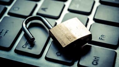 open security lock on computer keyboard - computer security breach concept