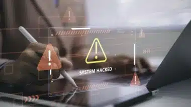 Business person using tablet with system hacked warning cybersecurity alert data breach protection risk network security threat detection digital technology and information safety