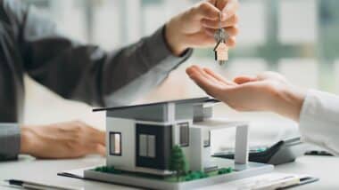 Real estate professionals and clients discussing home purchases